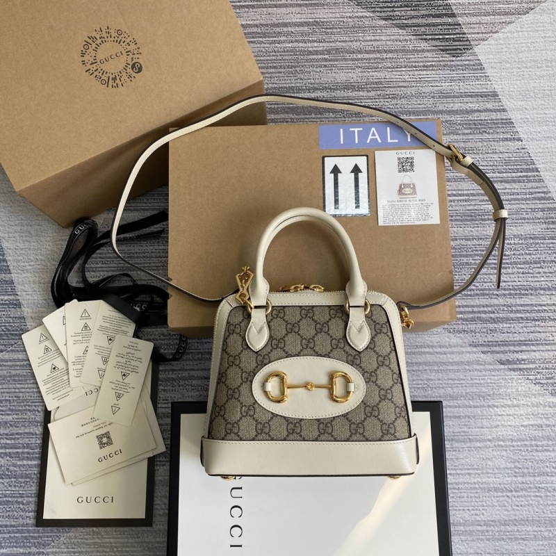 G*u*i top handle bags